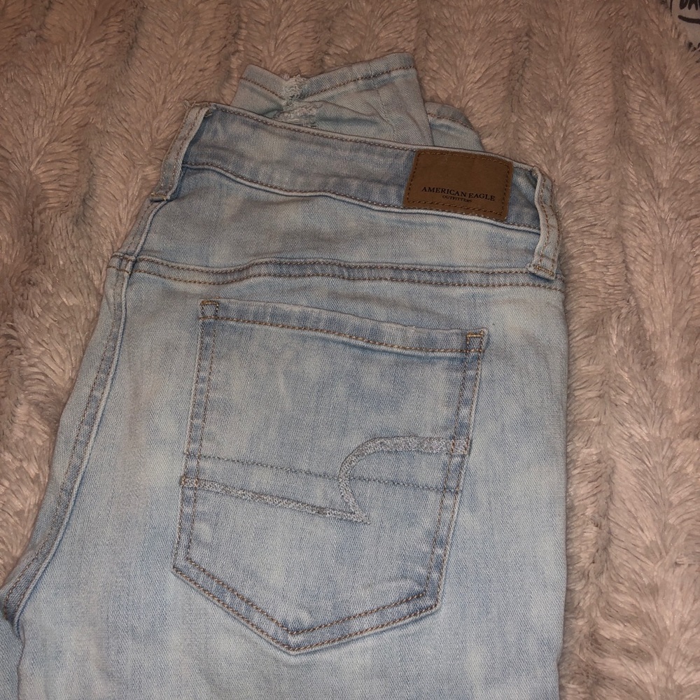 Light wash distressed AEO jeans
